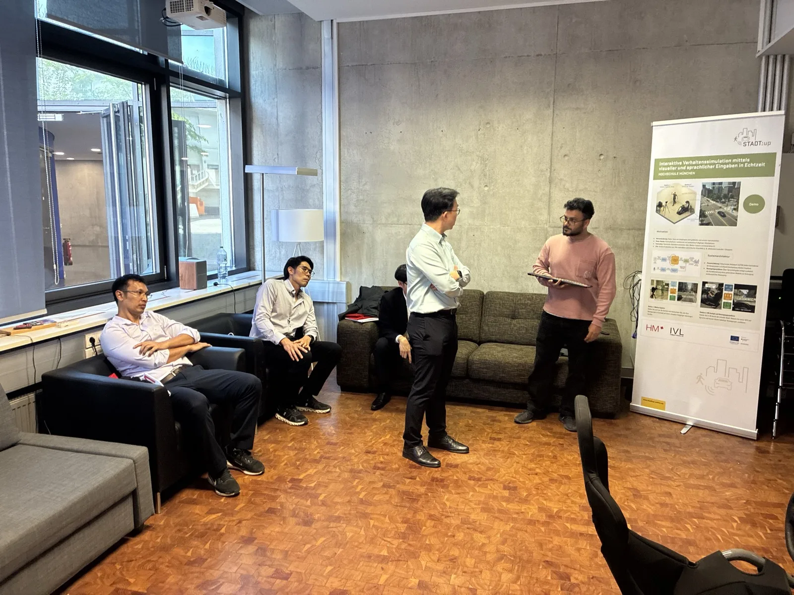 A lab presentation with an urban scene on the screen