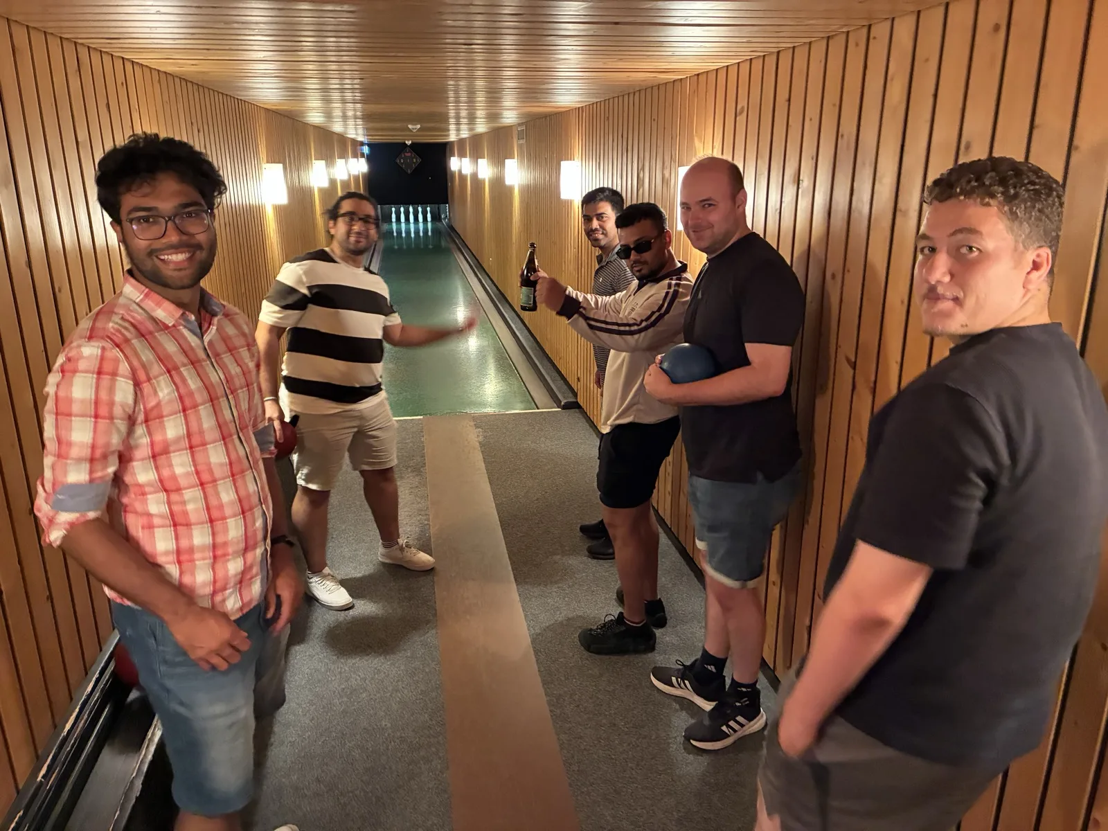 Lab members bowling during the workshop evening
